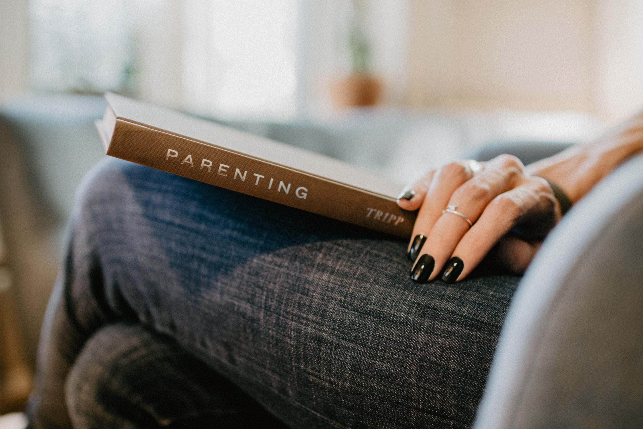 A mother reading about parenting